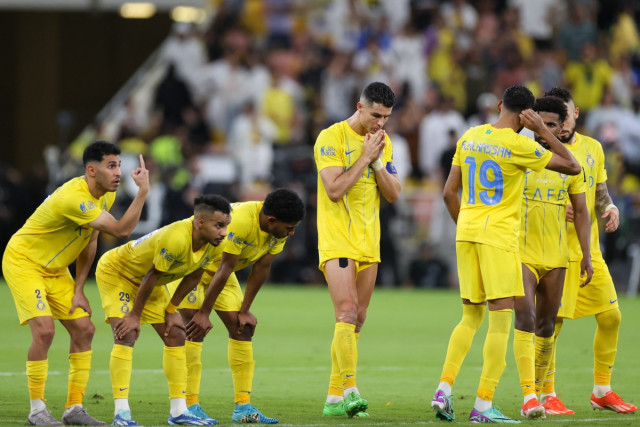 Nassr's players react in the penalty shootout during the King's Cup final match between Al-Nassr and Al-Hilal at the King Abdullah Sport City Stadium in Jeddah on May 31, 2024.